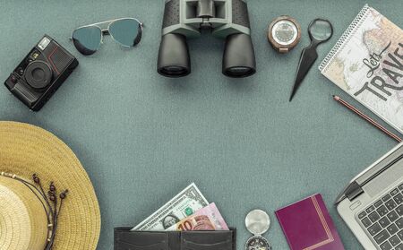 World travel set, consisting of a camera, a laptop, hat, binoculars, wallet with banknotes,...