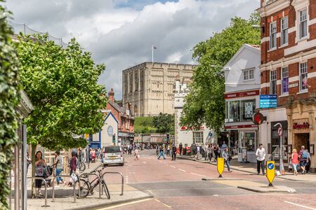 NORWICH, ENGLAND - JULY 8: View of a street in downtown Norwich with the castle in the background, on a sunny summer day on July 8, 2016 in Norwich, Englandのeditorial素材