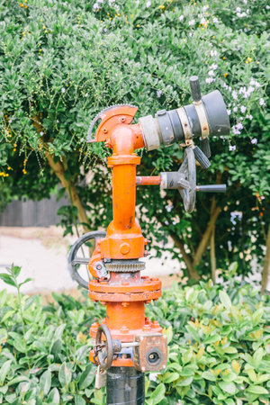 Water pump for firefighters located in a green park