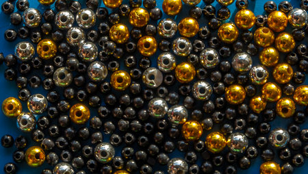 Set of decorative gold, silver and black balls with blue backgroundの写真素材