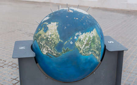 Representation in a model of the planet earth seen from North to Southの写真素材