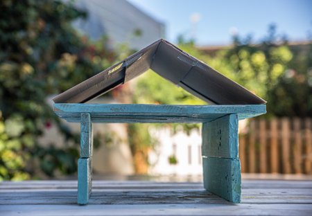 Recreation of a handmade blue wooden house. Sustainable construction conceptの写真素材