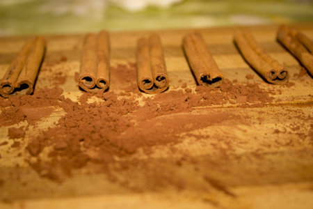 Cinnamon sticks and powder on woodの写真素材