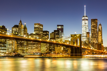 NEW YORK - AUGUST 22: Views of the Brooklyn Bridge on sunset on August 22, 2015. Its a famous and iconic bridge in New York, which passes the east river.のeditorial素材