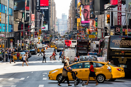 NEW YORK - AUGUST 22: Views of the rush streets of Manhattan at 7th Avenue on August 22, 2015. Its on the intersection of W53 Street near the Times Square.のeditorial素材