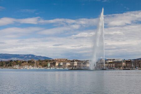 GENEVA, SWITZERLAND - APRIL 11: Exterior views of the buildings and fountain at the Geneva Lake on April 11, 2015. Its the second most populous city in Switzerland (after Zurich).のeditorial素材