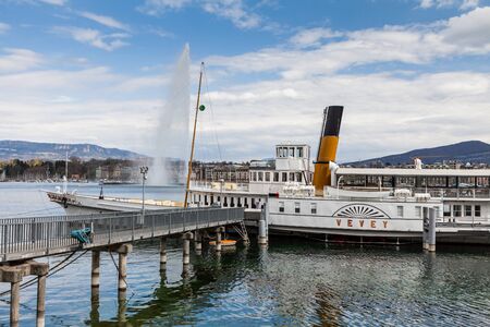 GENEVA, SWITZERLAND - APRIL 11: Exterior views of the buildings and fountain at the Geneva Lake on April 11, 2015. Its the second most populous city in Switzerland (after Zurich).のeditorial素材