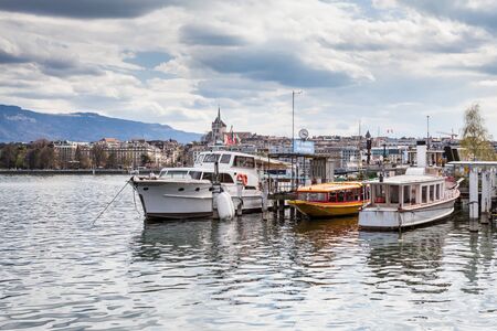 GENEVA, SWITZERLAND - APRIL 11: Exterior views of the buildings and fountain at the Geneva Lake on April 11, 2015. Its the second most populous city in Switzerland (after Zurich).のeditorial素材