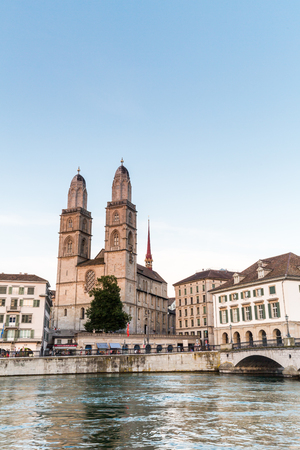 ZURICH, SWITZERLAND - JULY 4: Famous postcard view of various houses and churches in the old town part of Zurich at sunset on July 4, 2015. Zurich is the biggest city in Switzerland.のeditorial素材