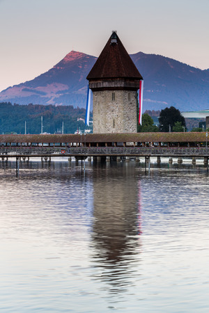 LUCERNE, SWITZERLAND - AUGUST 2: Views of the famous bridge Kapellbruecke on late afternoon in Lucerne on August 2, 2015. Lucerne is a famous tourist destination in Switzerland.のeditorial素材
