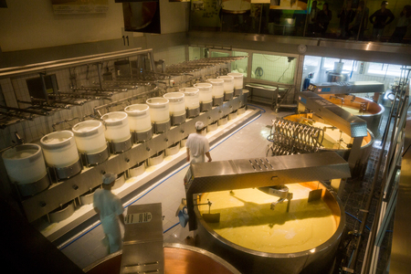 GRUYERES, SWITZERLAND - MAY 23, 2015: Interior view of a cheese diary in the historical town Gruyeres in the canton of Fribourg, Switzerland on May 23, 2015. Gruyere is a famous swiss cheese.のeditorial素材
