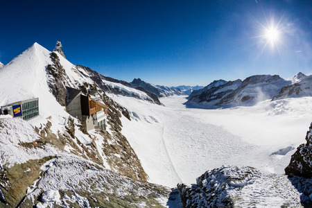 JUNGFRAUJOCH, SWITZERLAND - JANUARY 6, 2017: View to the Jungfraujoch observation station and Aletsch Glacier on January 6, 2017. Its the highest elevated point to reach by a cog railway in Europe.のeditorial素材