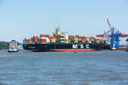 HAMBURG, GERMANY - JUNE 4, 2016: View of a ship in the Port of Hamburg and the Elbe river on June 4, 2016. It is Germanys largest port and is named the countrys Gateway to the World.のeditorial素材