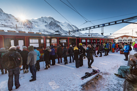 WENGEN, SWITZERLAND - JANUARY 6, 2017: View of the ski and toursim resort Jungfrau Wengen on January 6, 2017. Tourist are waiting for the train to the Junfgraujoch summit.のeditorial素材