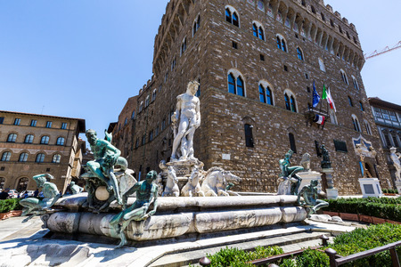 FLORENCE, ITALY - JULY 17, 2016: Buildings and the Fountain of Neptune at the Piazza della Signoria on July 17, 2016. Its an large L-shaped square in front of the Palazzo Vecchio.のeditorial素材