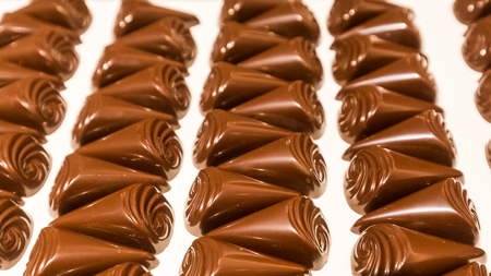 Detail view of chocolate pralines on a serving table prepared for degustation