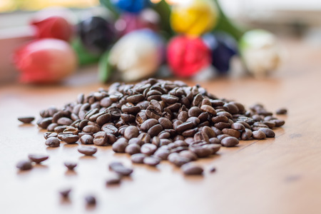 Small handful lot of brown roasted coffee beansの写真素材