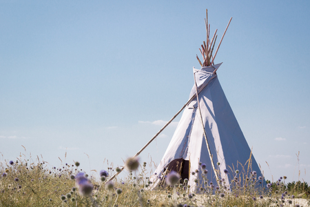 Summer vacation camping tent, indian wigwam hut, in dry wild nature steppe desertの写真素材