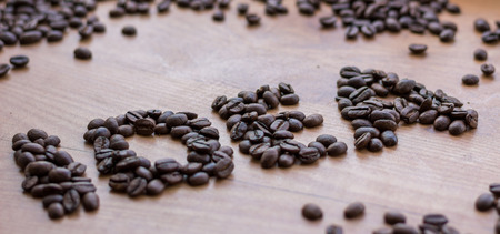 Idea concept sign drawn among brown well roasted coffee beansの写真素材