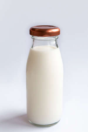 Image of fresh milk in a clear glass bottle on a white background.
Fresh milk for good health,Fresh...