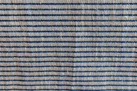 Picture of a horizontal alternating dark and white woven fabric texture. fabric material for...