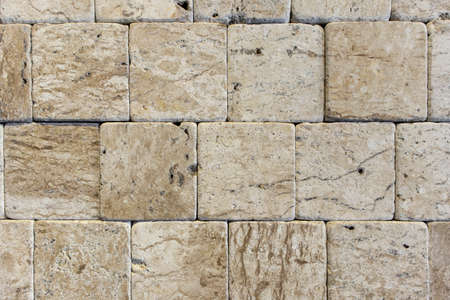 stone wall cut small squares together,interior material,brown stone wall
