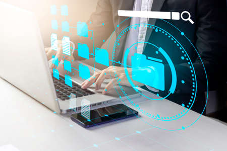 Businessman look up documents and sort items for efficiency.,Systematic search document information concept.,defragmentationの写真素材