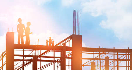 Silhouettes of engineers and building structures under construction.,2d illustration