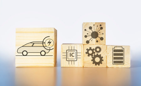 electric car and system icon on wooden box light gray backgroundの写真素材