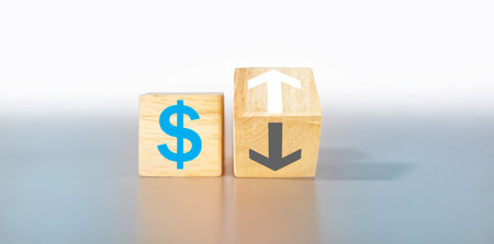 Money icon and arrow on wooden box light gray background,exchange rate and currency financial businessの写真素材