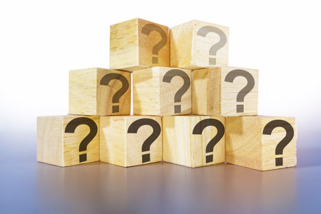 question icon on wooden box light gray background,Abstract image of doubt and ignorance