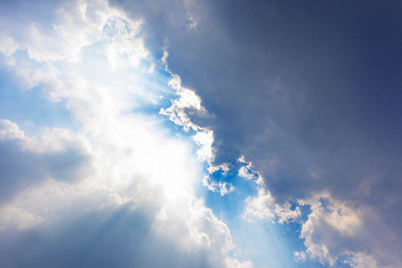 Blue sky and white clouds with sunlight,Blue sky and floating cloudsの写真素材