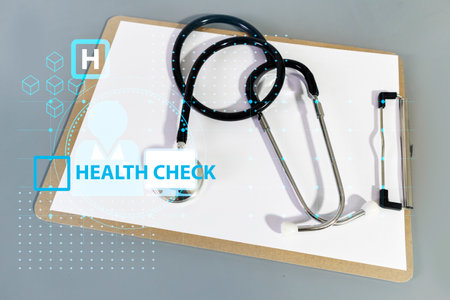 medical stethoscope on gray table writing paper,clinical medical treatment,health check,Medicine and Researchの写真素材