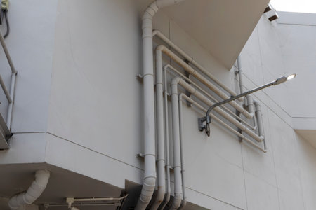 Outside the building, bile and sewerage system pipes are installed.の写真素材