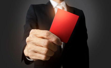 In the corporate world, communication A businessman is holding a red piece of paper that says an...