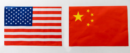 USA and China flags on white background.,Trade, investment, exports and imports of the United States and China.の写真素材
