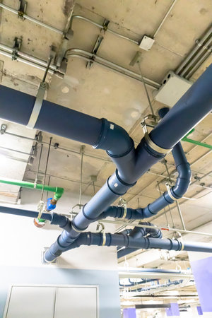 A thin pipe is EMT metal conduit or EMT zinc-plated pipe. Steel plates, either hot- or cold-rolled, are used to make it. or a sheet of galvanized steel The inside surface has an enamel coating.の写真素材