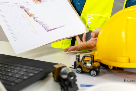 When a project is being built, construction and system engineers provide construction plans and provide data explanations.の写真素材