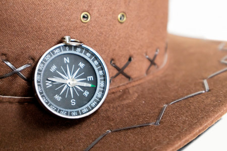 Compass and hat story of travel and direction in life.の写真素材