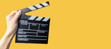 Director's board on a blank yellow background with text. Thinking of a storyline.の写真素材