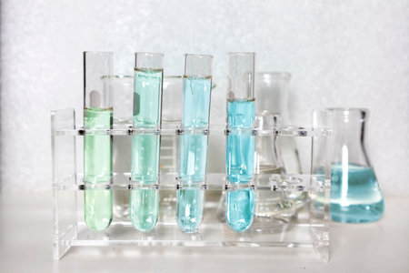 Clear bottles and dishes are used in scientific and medical experiments.の写真素材