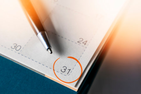 Black business pen on calendar background. Appointment planning work schedule.の写真素材