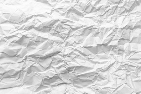 Heavy wrinkles of white crumpled paper used in background illustration.の写真素材