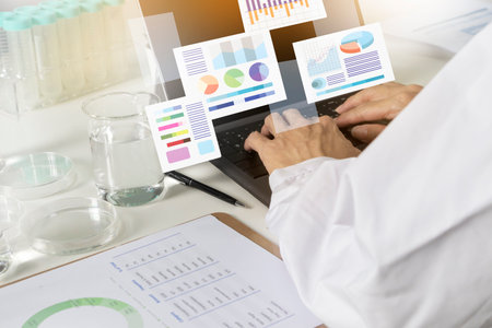 Researchers study data and conduct chemical experiments, in the creation of drugs, scientific data collection experimentsの写真素材