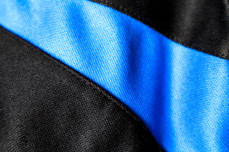 The black and blue fabric has wrinkles and the texture is rough.の写真素材