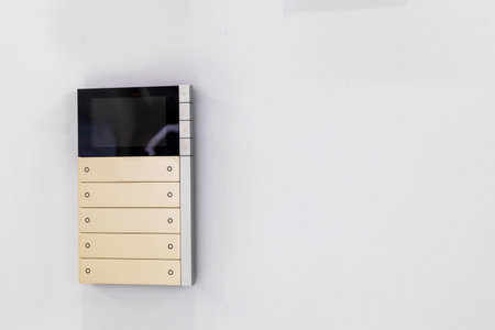 White wall mounted light switch panel