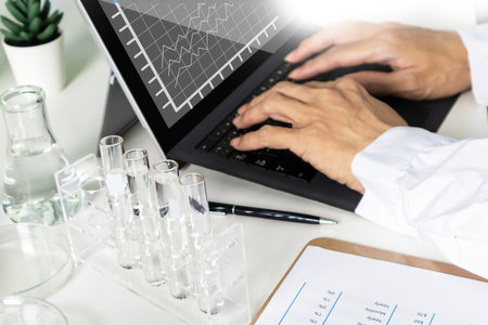 Researchers study data and conduct chemical experiments, in the creation of drugs, scientific data collection experimentsの写真素材