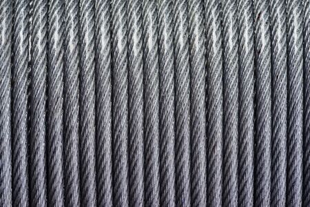 Lines from a steel cable laid in a strict texture. bight. technological background