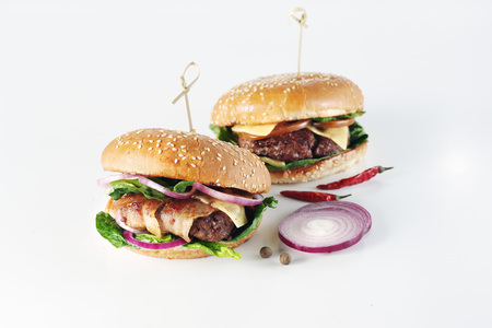 Two classic tasty burger on a white background.の写真素材