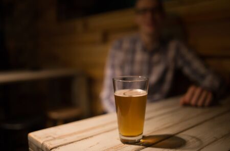 Man in a pub in front of beerの写真素材